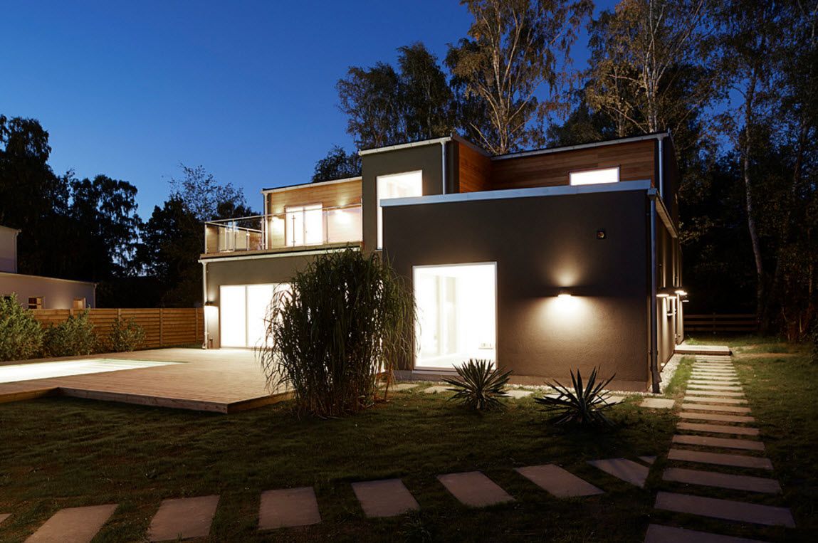 Swedish Private House Contrasting Design. Backyard of the household is full of artificial multileveled illumination