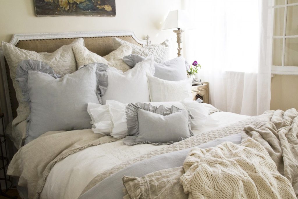 Many pillows on the bed