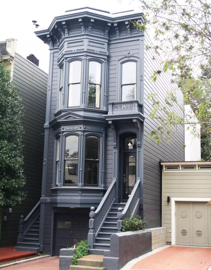 Original House Exterior Design Ideas. Old American naroow house in the big city stylized with black trimming