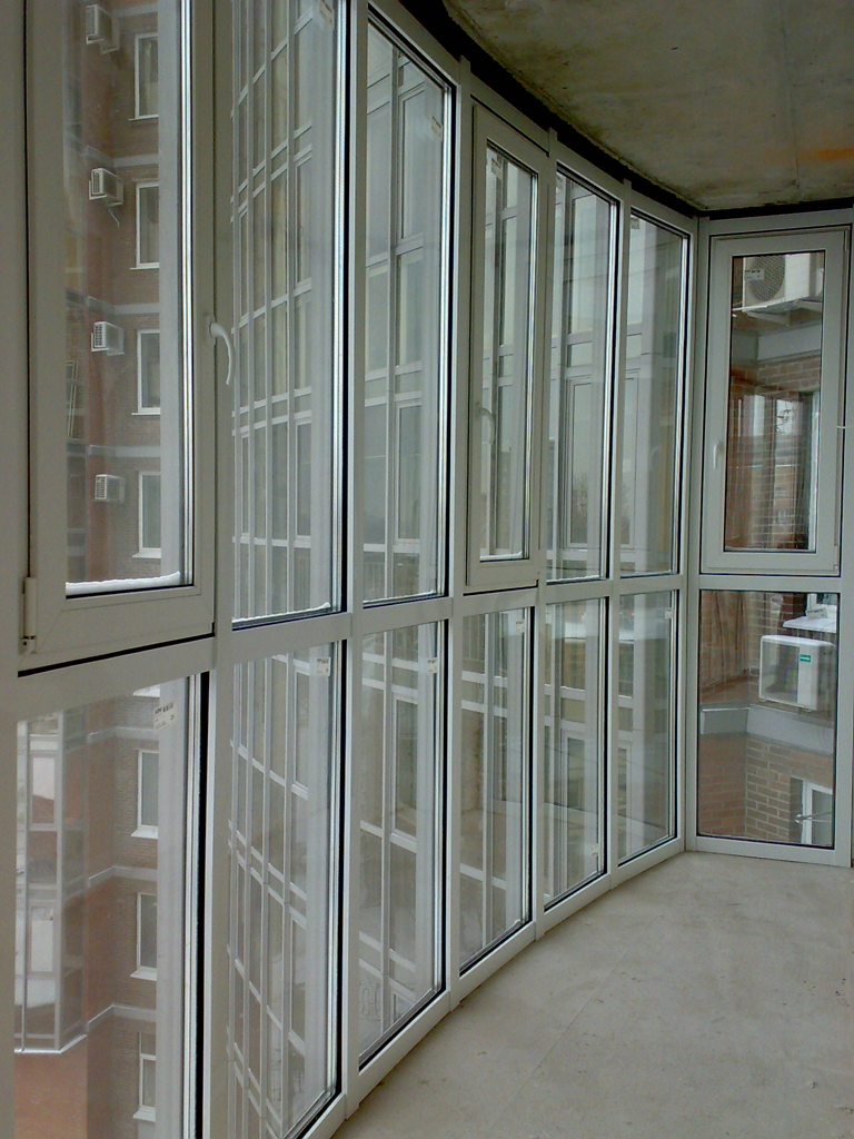 Modern Glazing for Balcony or Loggia. Wall-height frame of the window panes