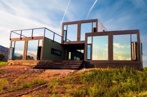 Cargo Container House Design Ideas. Glass mirroring surfaces of the panoramic windows