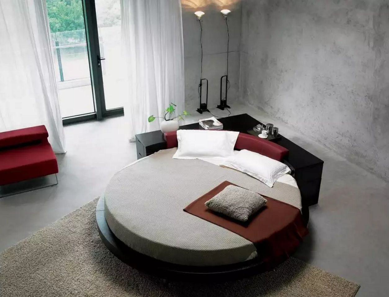 Circle Bed of Unique Bedroom Interior Design. Loft and industrial style mixing with the round bed as an accent of the overall atmosphere