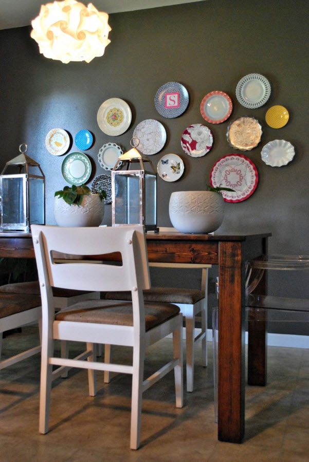 Decorative Plates on the Wall of the Dining room. Colorful accent on the dark beige wall