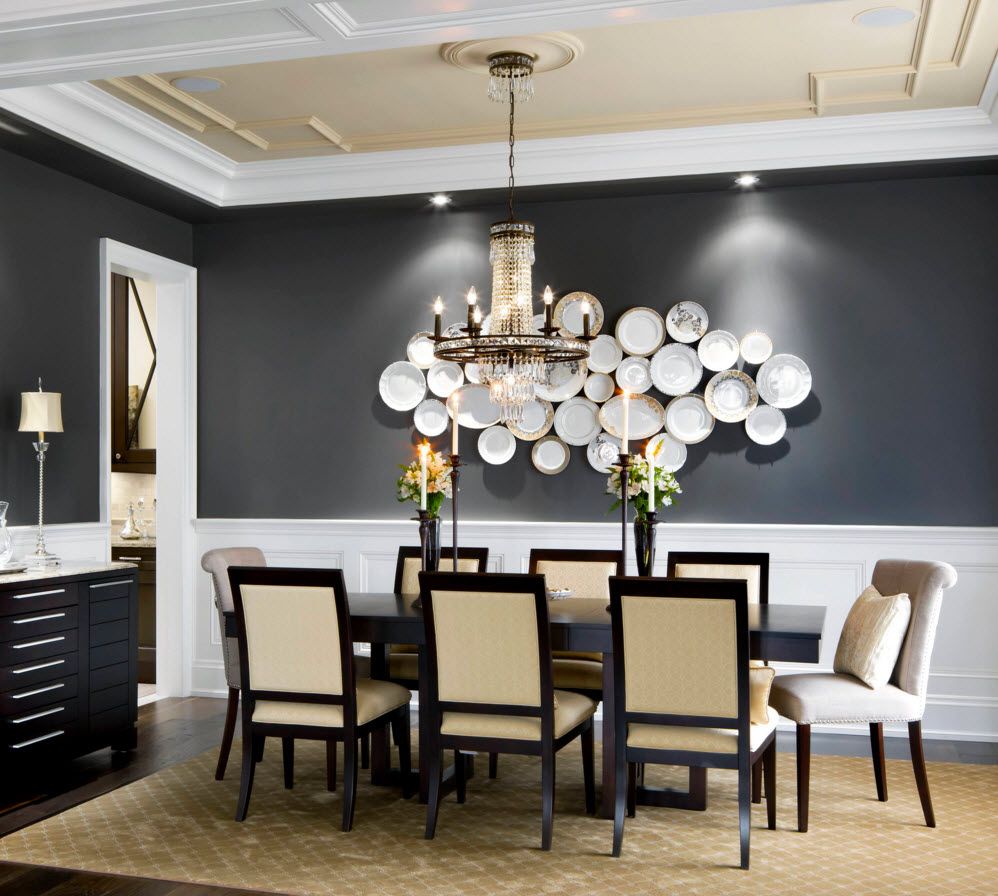 Decorative Plates on the Wall of the Dining room. Nice installation of plates on the black wall in contemporary styled dining