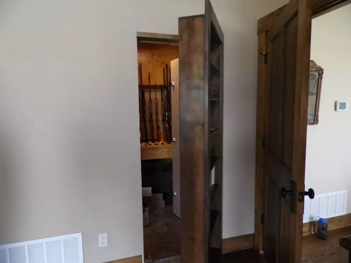 Secret door to the vine cellar behind the wooden cabinet in the living room