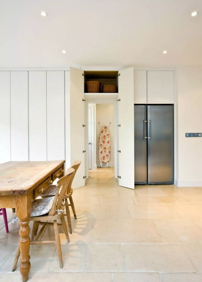 White trimmed dining room with the hidden door 