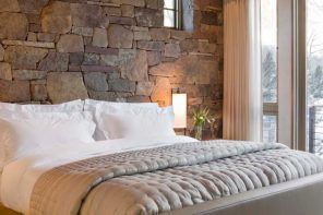 Stone decorated headboard in the bedroom