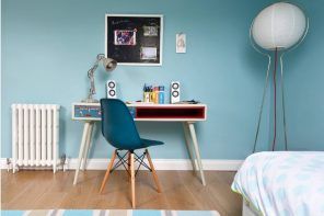 Creative interior design for the boys room with painted blue walls and furnished in modern style