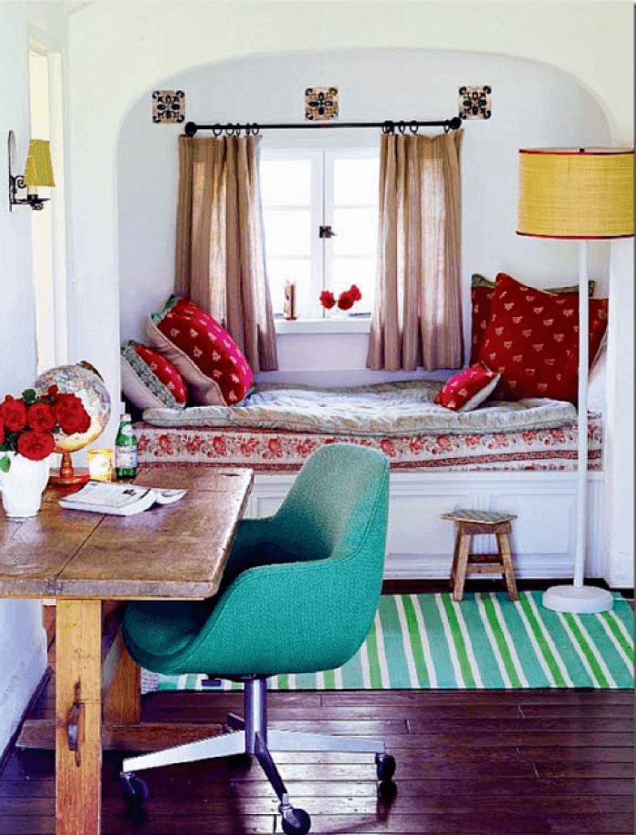 Small kids' room with turquoise notes in the decor and full-sized bed at the window sill