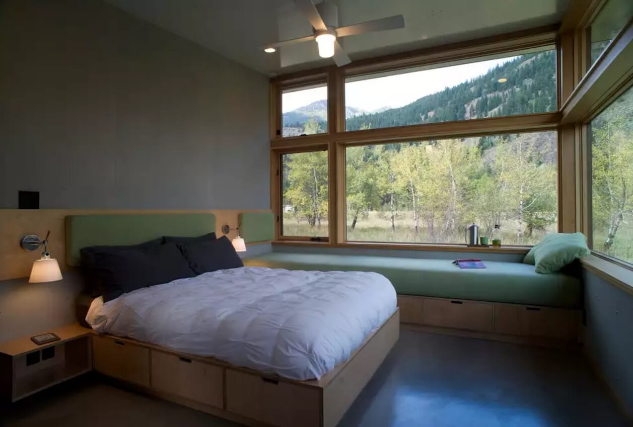 Window Sill Transformation into Uniquely Designed Cozy Additional Bed. Middle American mountain view and the cottage