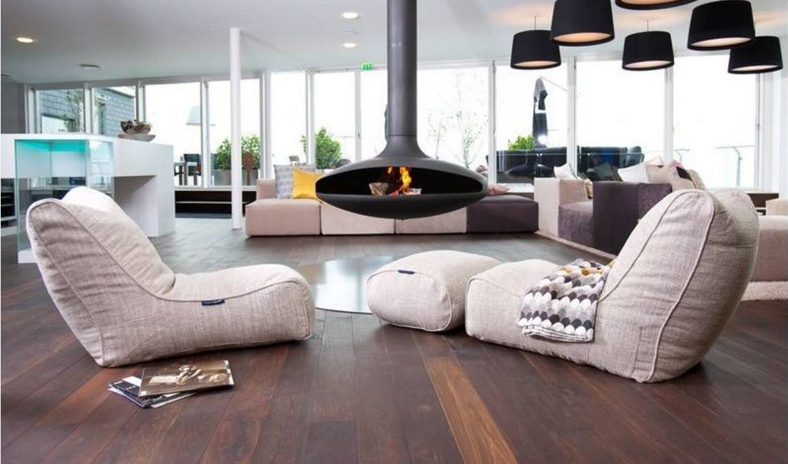 Gorgeous and fresh modern interior with domed fireplace and upholstered furniture at the living