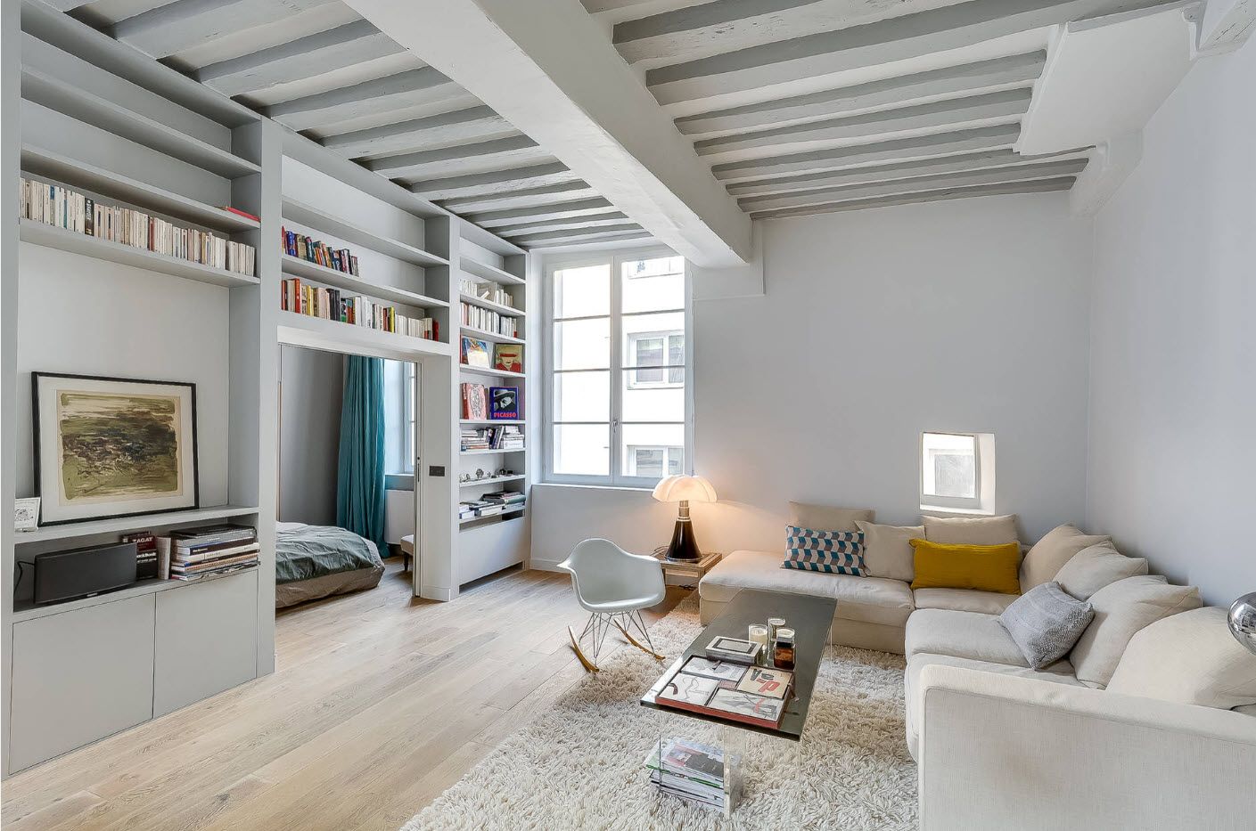Open layout and wooden ceiling beams in pronounced loft styled room