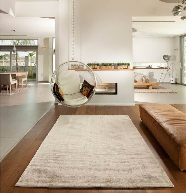 Suspended Bubble Chair. Modern Interior Ideas. Warm coffee and milk color palette for modern studio apartment