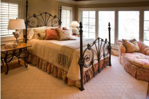 Wrought-iron Bed as a Stylish and Functional Interior Element. Classic forms for the bed frame