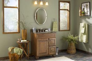 Wooden cabinet, mirror and the olive wall in the entrance