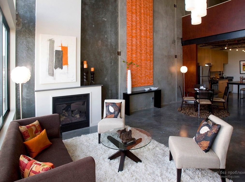 Orange decoration in the large private house's living room in dark tones