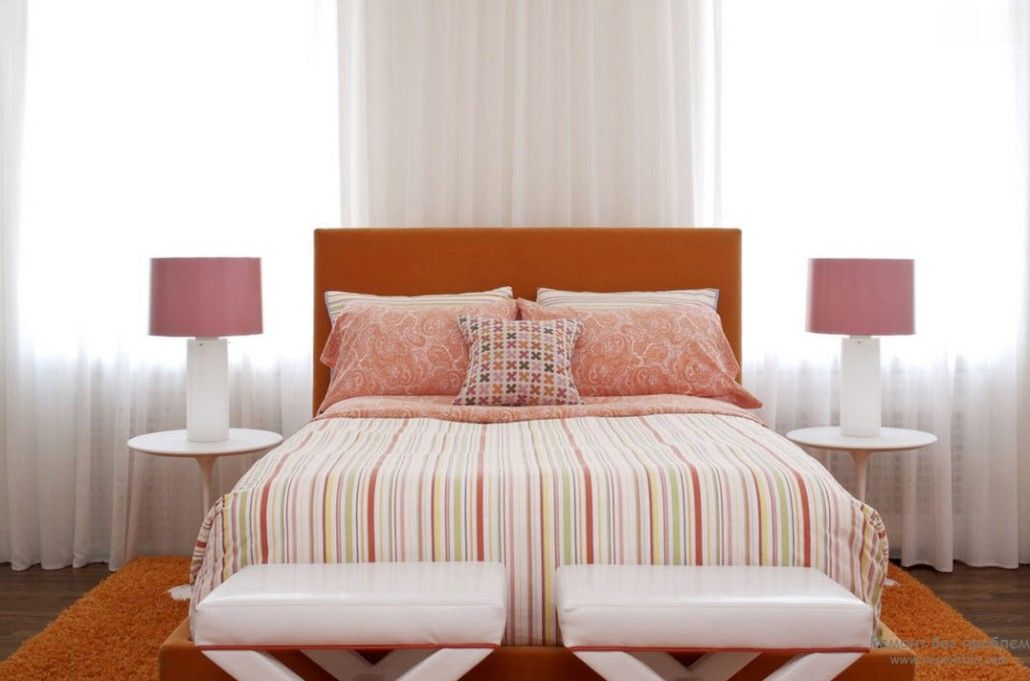 Creamy colored bedroom with orange carpet
