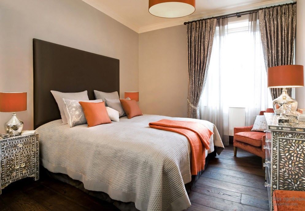 Orange Color Interior Decoration Real Photo Examples. Brown headboard and dark wooden floor in the bedroom