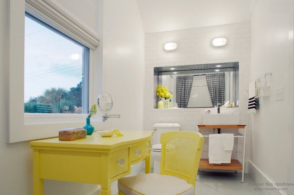 Yellow vanity and the monolith gray execution of the bathroom