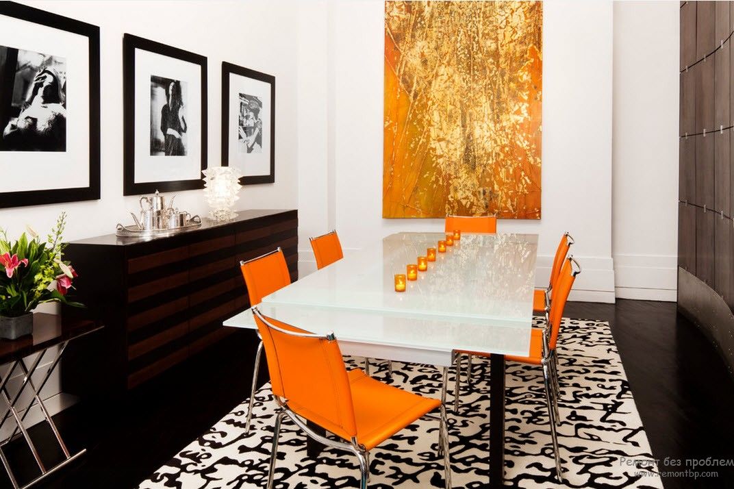 Dining room with the orange set of chairs and white glossy table