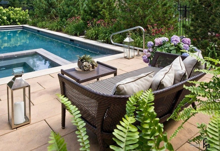 Poolside small patio of only the wicker sofa and the coffee table