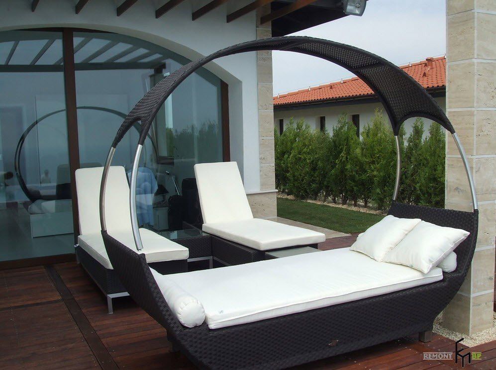 Patio furniture outdoor. Reviewing Types with Photo. Hammock with white mattress and pillows looks like crib