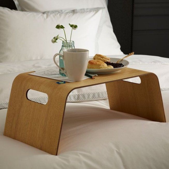 Modern minimalsitic form of the bed tray of wood