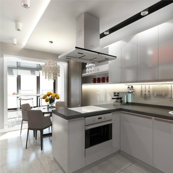 Modern open layout hi-tech designed kitchen with steel surfaces of the hood