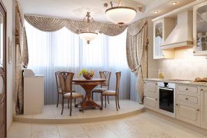 Classic designed kitchen with the dining zone in the balcony zone and on the pedestal of the floor difference