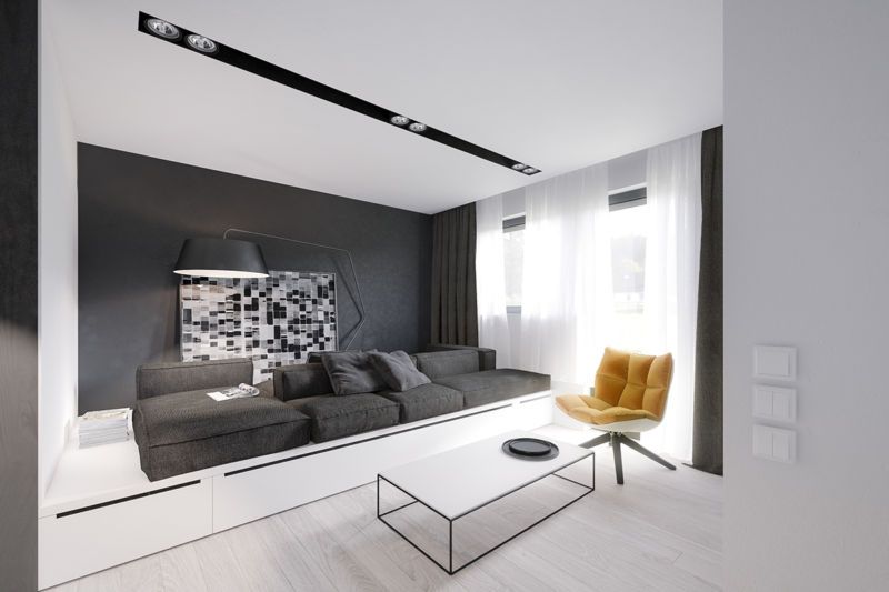 Original white and gray color combined interior with two pronounced zones and steel-glass coffee table