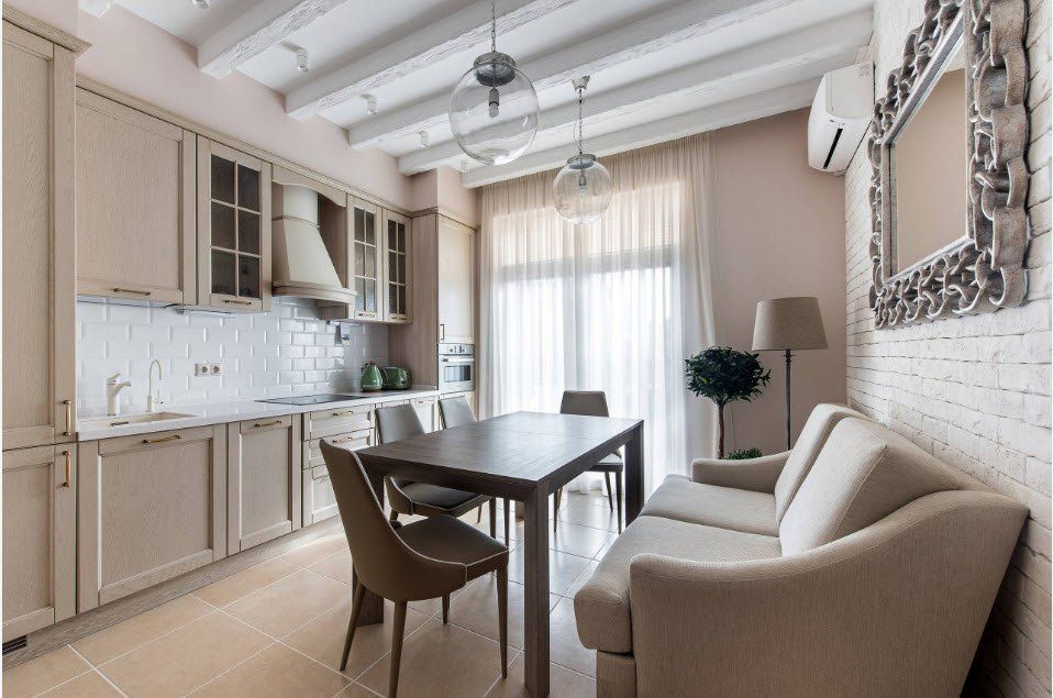 Open ceiling beams and the large dining zone of the Casual styled kitchen