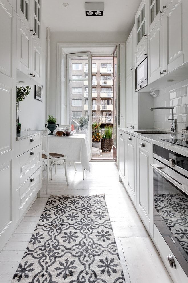 White prim glossy surfaced galley kitchen