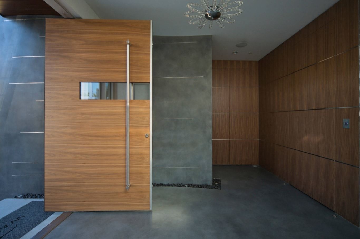 Sliding wooden doors in the HI-tech interior with concrete finished walls