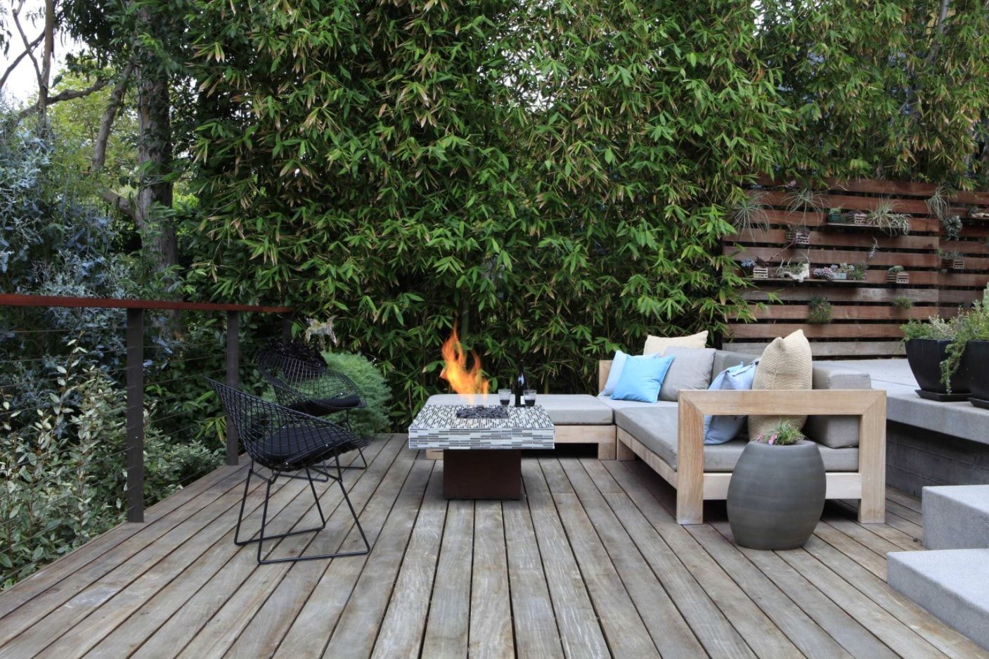 Backyard BBQ zone with gray wooden planked flooring