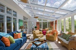 What is a Sunroom? 15 Best Sunroom Interior Decoration Ideas. Transparent roof of the annex of the private house with metal frame and Casual multicolored interior