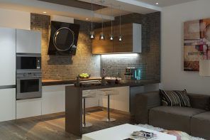 Kitchen in Living Room with Bar Counter. Original Interior Ideas. Gray counter theme and the furniture set in same pattern on hi-tech kitchen