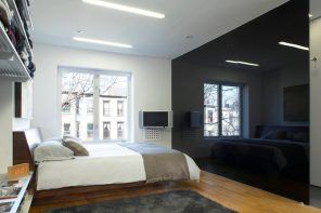 Black glass partition for the hi-tech styled room