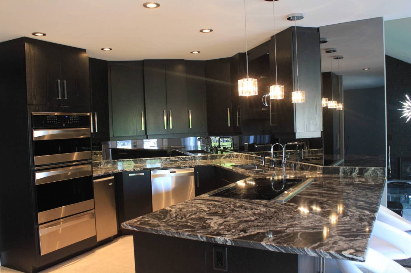 Hi-tech Kitchen in dark tones with marble countertop