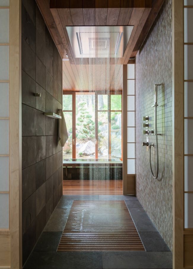 Tropic passing shower zone with granite wall and wooden lattice base in master bathroom of Modern decorated seashore mansion