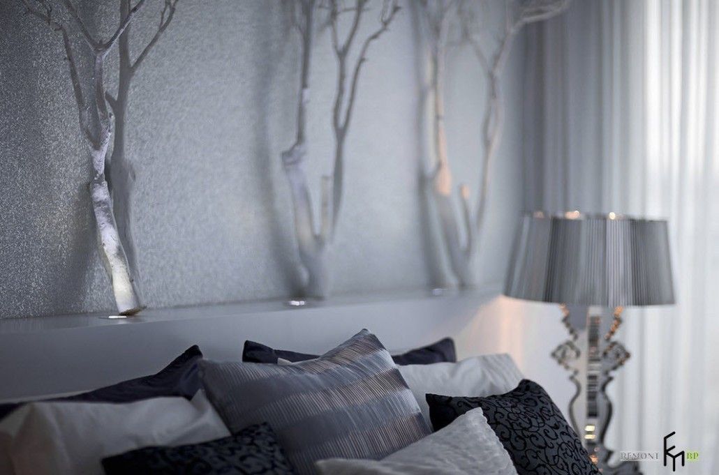 Unusual headboard decoration in the form of winter forest trees