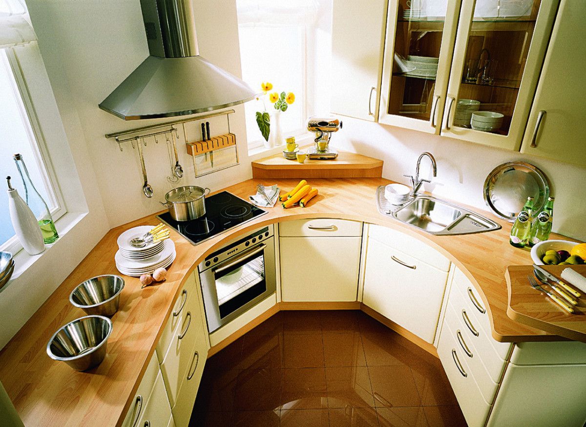 Unusual u-shaped variant of the layout at the light decorated kitchen