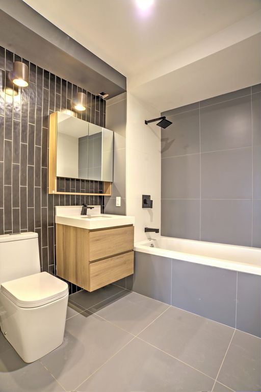 Making Small Condo Interior Design Maximally Effective Ideas. Space optimized bathroom in dark blue metro tiles