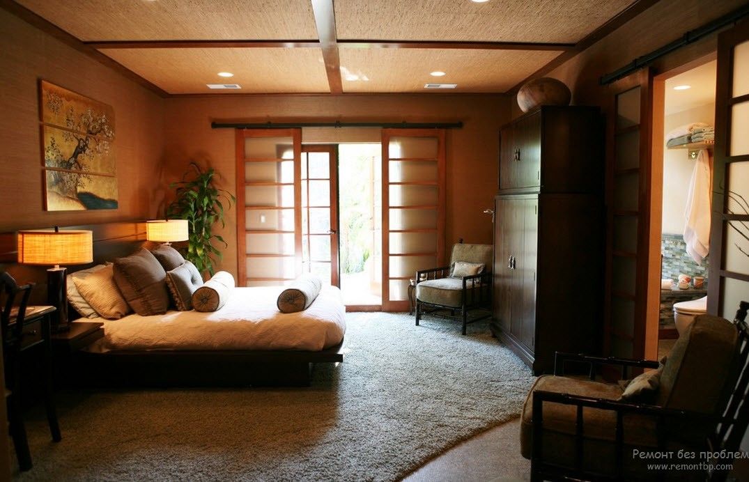 Typical Japanese interior of the bedroom with bonsai, sliding doors and light wooden palette