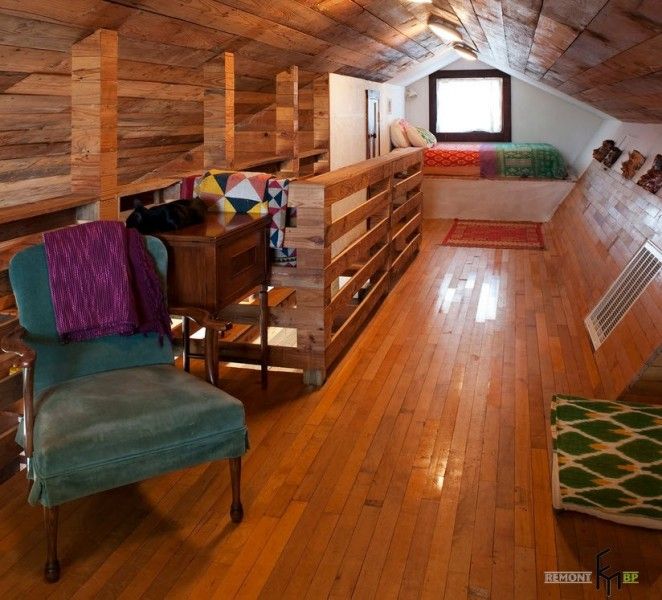 Attic with wooden trimming and creative arrangement