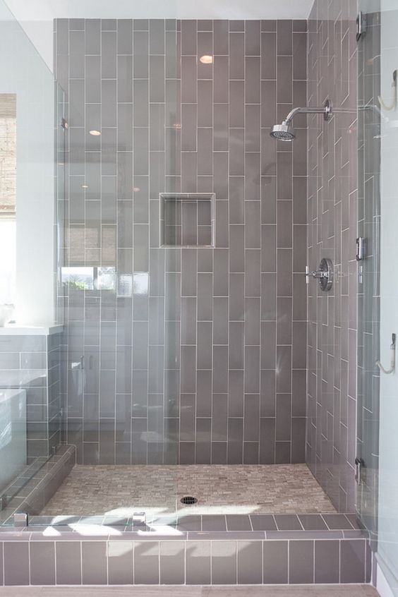 Gray tile with light grout for the glass zoned shower