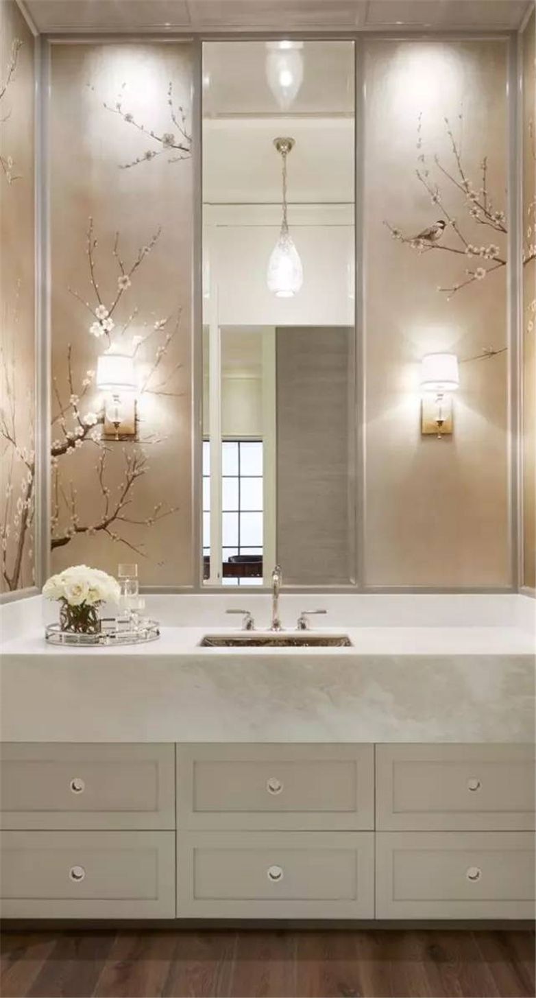 Bathtub of artificial stone and the large mirror in the Classic bathroom