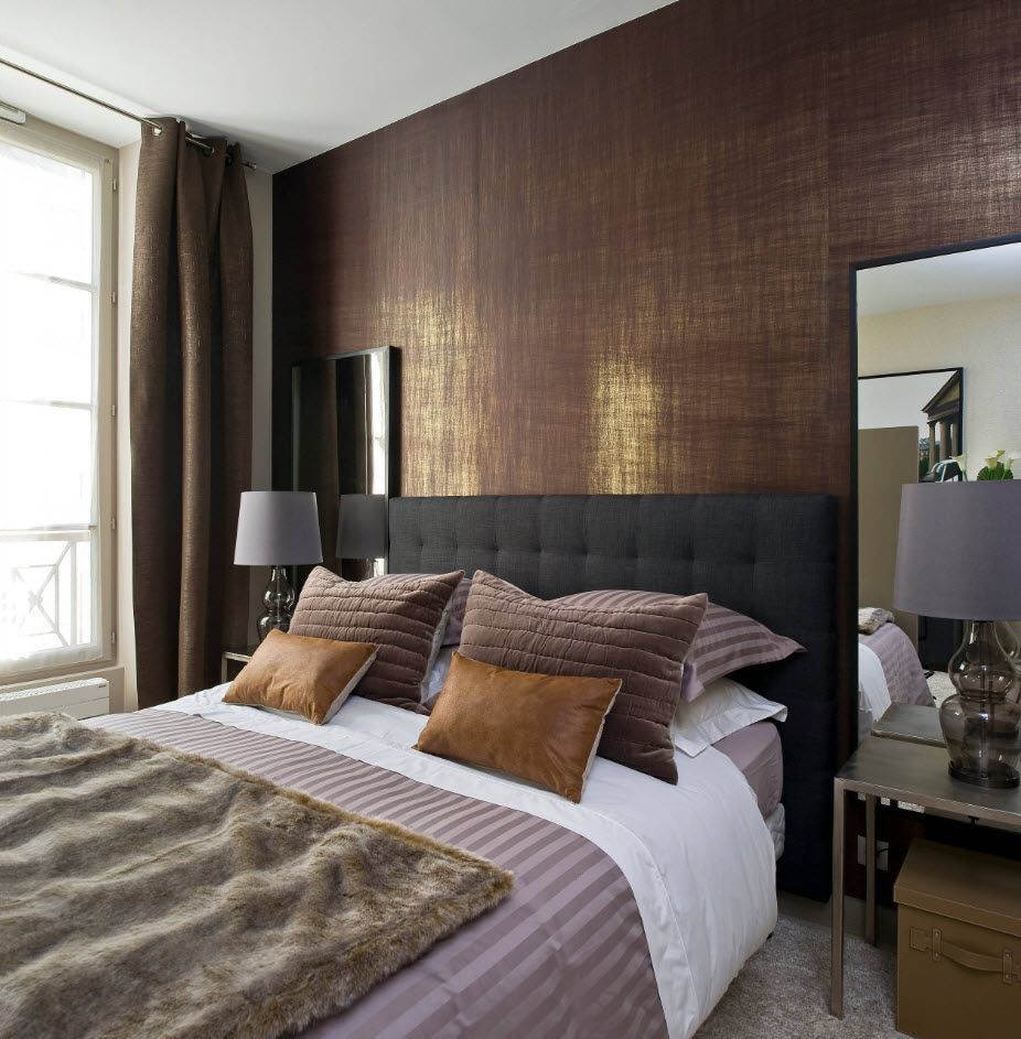 Chocolate heaboard trimmed with wallpapaer in the Modern bedroom