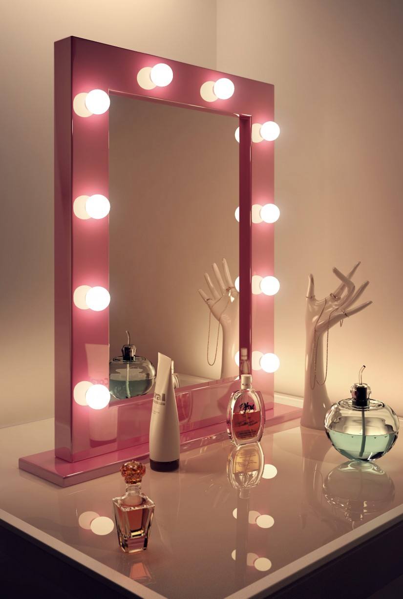 Red framed mirror with bulb backlight