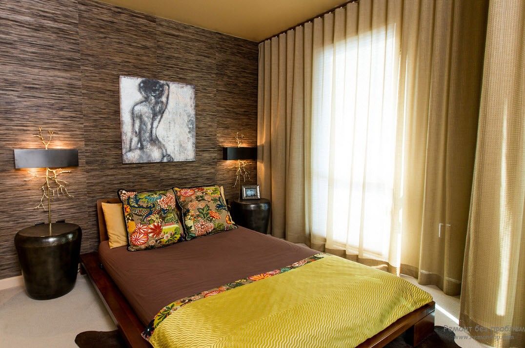 Yellow coverlet for nice decorated Japanese bedroom with stone wall