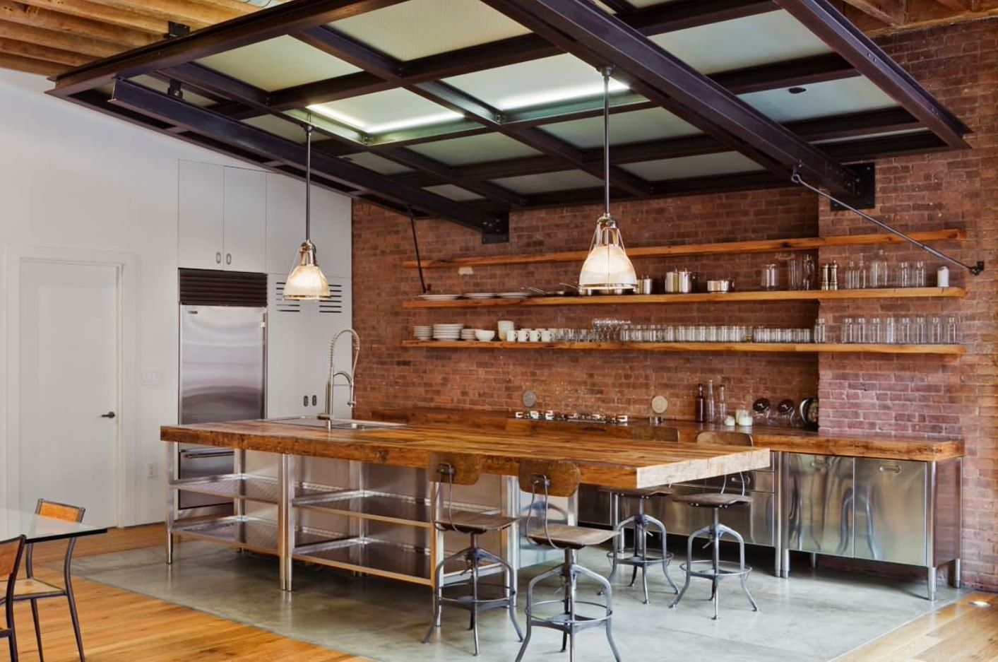 Industrial styled kitchen with metal lamps